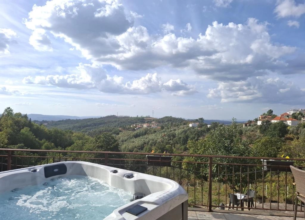 Outdoor jacuzzi with panoramic valley view
